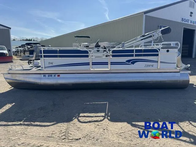 Slide: The Image of 2011 TMC 2200 SE Pontoon boat parked outdoors at Boat World dealership. - 41