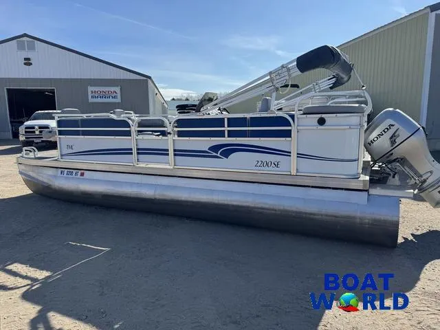 Slide: The Image of 2011 TMC 2200 SE Pontoon boat with Honda engine at Boat World dealership. - 42