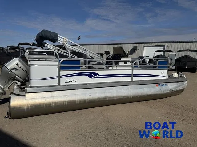 Slide: The Image of 2011 TMC 2200 SE Pontoon boat parked outdoors at Boat World dealership. - 45