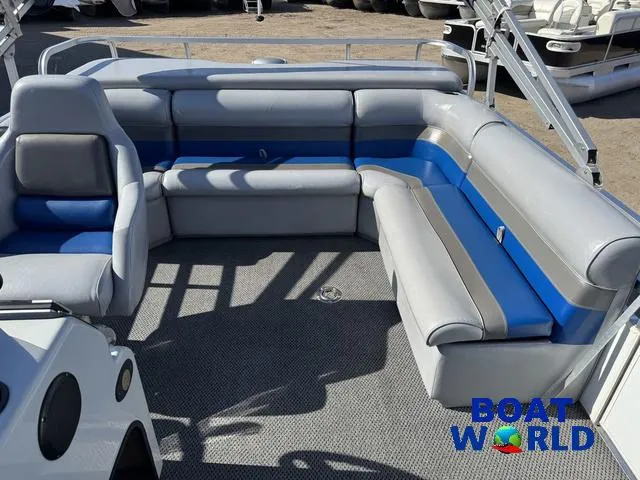 Slide: The Image of 2011 TMC 2200 SE Pontoon boat interior with gray and blue seating, showcased at Boat World. - 5