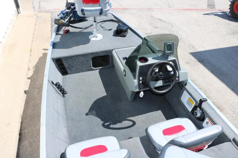 Slide: The Image of 2014 Tracker Pro 160 boat interior with steering console and seating. - 13
