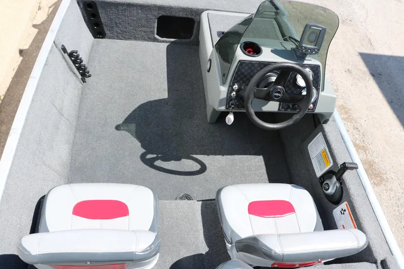 Slide: The Image of 2014 Tracker Pro 160 boat interior with steering console and seating. - 14