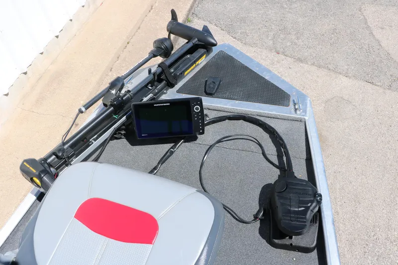 Slide: The Image of 2014 Tracker Pro 160 boat interior with steering controls and navigation equipment. - 17