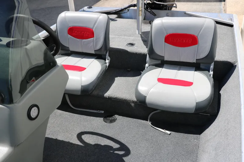Slide: The Image of 2014 Tracker Pro 160 boat interior with two gray and red seats. - 24