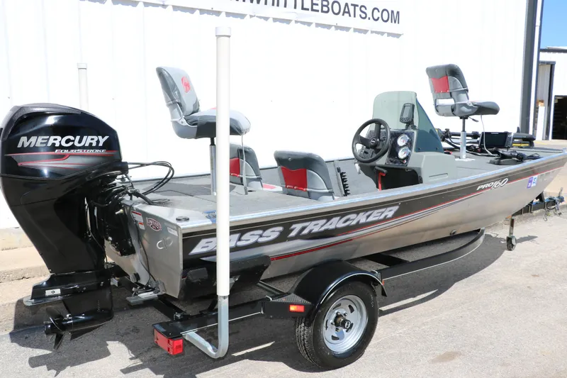Slide: The Image of 2014 Tracker Pro 160 boat with Mercury engine, parked on a trailer. - 3