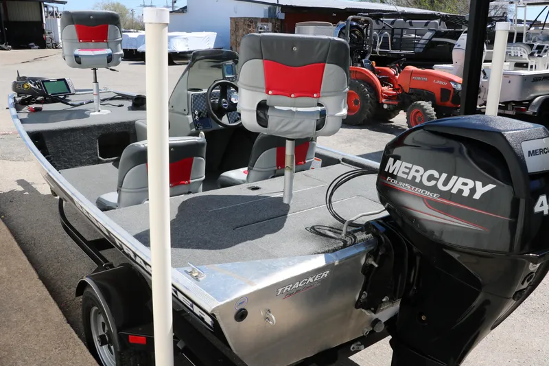Slide: The Image of 2014 Tracker Pro 160 boat with Mercury 40 engine, featuring red and gray seating. - 7