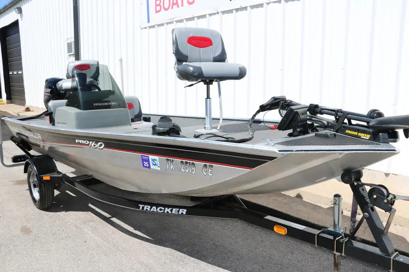 Slide: The Image of 2014 Tracker Pro 160 fishing boat on trailer, parked outside a building. - 9