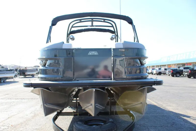 Slide: The Image of 2025 Avalon Excalibur LTD Quad Lounge 25 FT pontoon boat, rear view in a parking lot. - 10