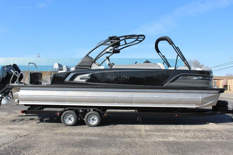 Slide: The Image of 2025 Avalon Excalibur LTD Quad Lounge 25 FT pontoon boat on trailer. - 3