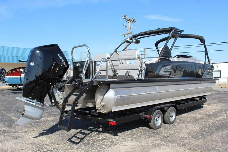 Slide: The Image of 2025 Avalon Excalibur LTD Quad Lounge 25 FT pontoon boat on trailer, rear view. - 4