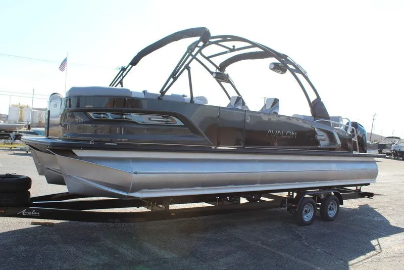 Slide: The Image of 2025 Avalon Excalibur LTD Quad Lounge 25 FT pontoon boat on trailer. - 9