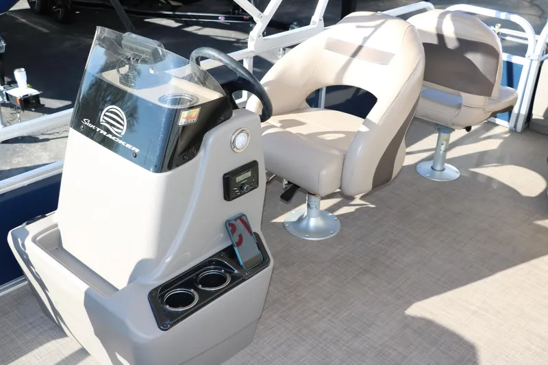 Slide: The Image of 2023 Sun Tracker Bass Buggy 18 DLX interior with steering console and seating. - 25