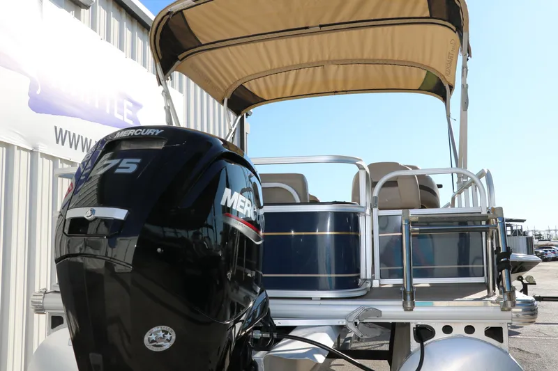 Slide: The Image of 2023 Sun Tracker Bass Buggy 18 DLX pontoon boat with Mercury 75 engine and canopy. - 4