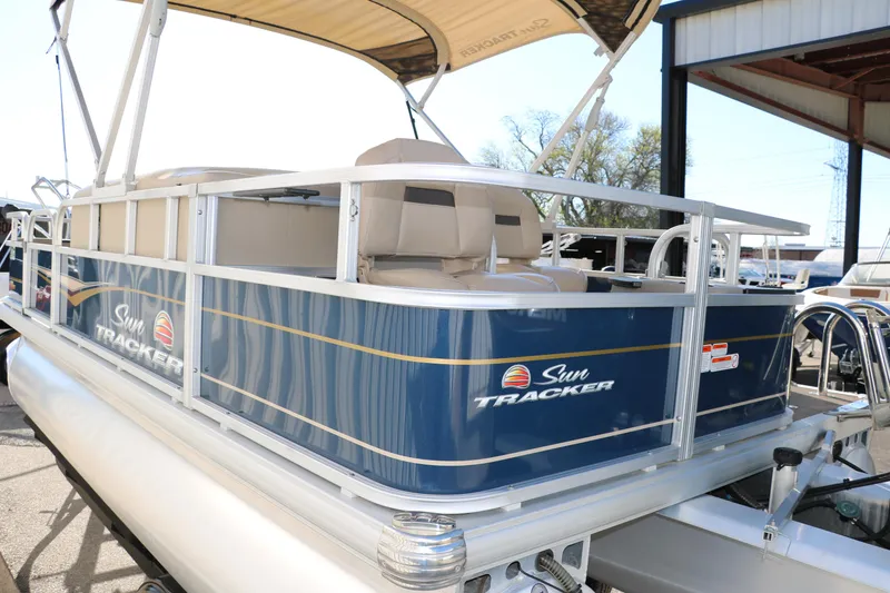 Slide: The Image of 2023 Sun Tracker Bass Buggy 18 DLX pontoon boat with blue exterior and canopy. - 6