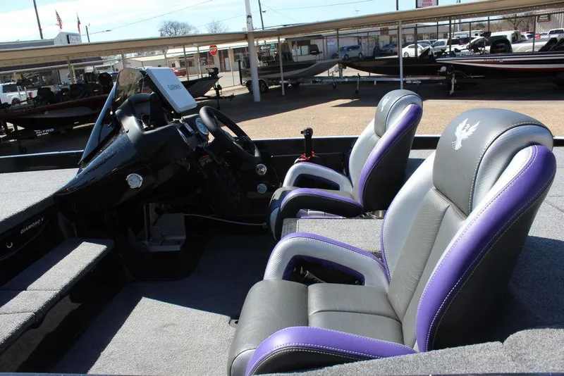 Slide: The Image of 2025 Phoenix 721 ZXL boat interior with dual seats and modern dashboard. - 10