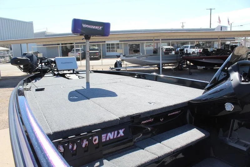 Slide: The Image of 2025 Phoenix 721 ZXL boat with spacious deck and advanced navigation equipment. - 11