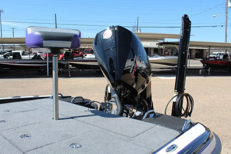 Slide: The Image of 2025 Phoenix 721 ZXL boat with powerful outboard motor and sleek design. - 13