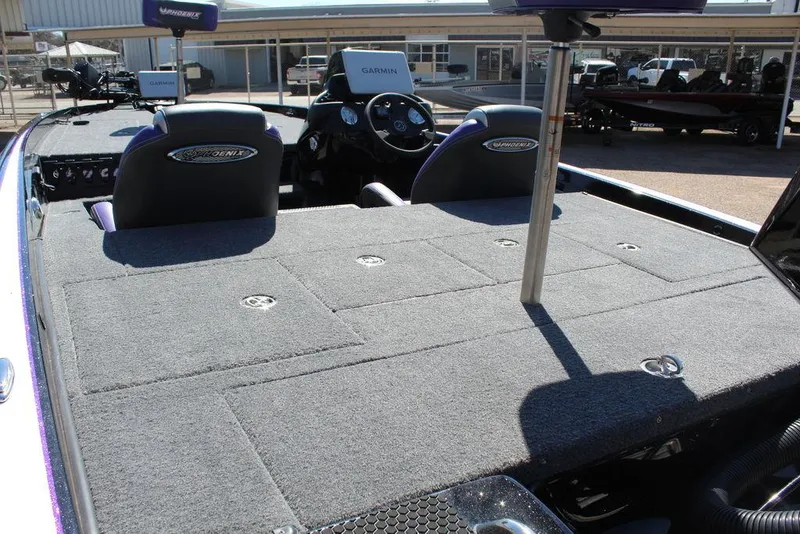 Slide: The Image of 2025 Phoenix 721 ZXL boat interior with spacious deck and seating. - 14