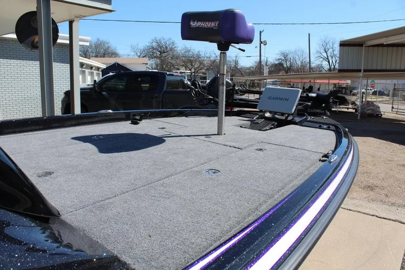 Slide: The Image of 2025 Phoenix 721 ZXL boat deck with Garmin electronics and fishing equipment. - 16