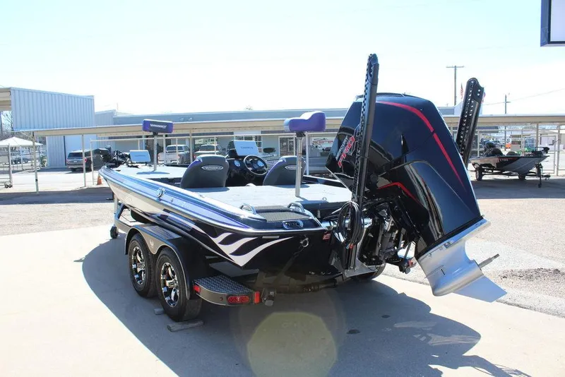 Slide: The Image of 2025 Phoenix 721 ZXL boat with dual motors and sleek design in a sunny outdoor setting. - 7