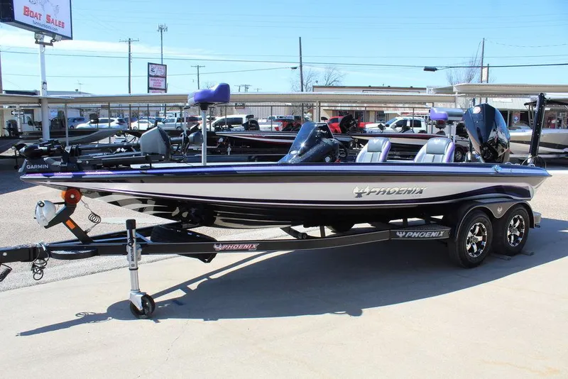 Slide: The Image of 2025 Phoenix 721 ZXL boat on trailer at dealership, side view. - 8