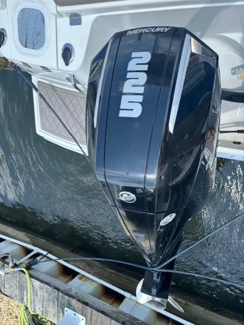 Slide: The Image of 2022 Finseeker 230 CC boat with Mercury outboard engine, docked on water. - 19