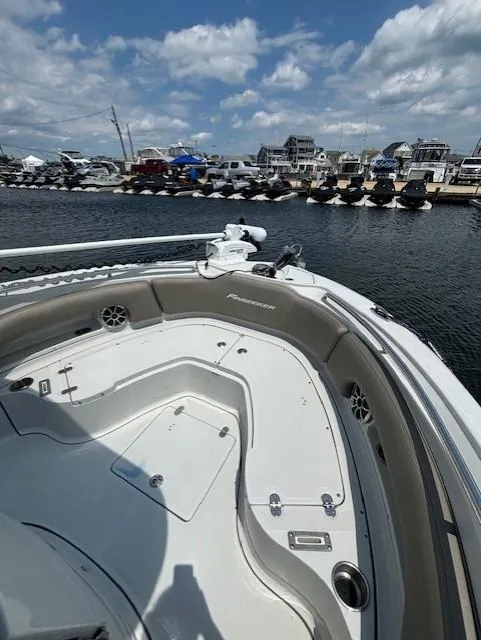 Slide: The Image of 2022 Finseeker 230 CC boat docked at marina under blue sky. - 9