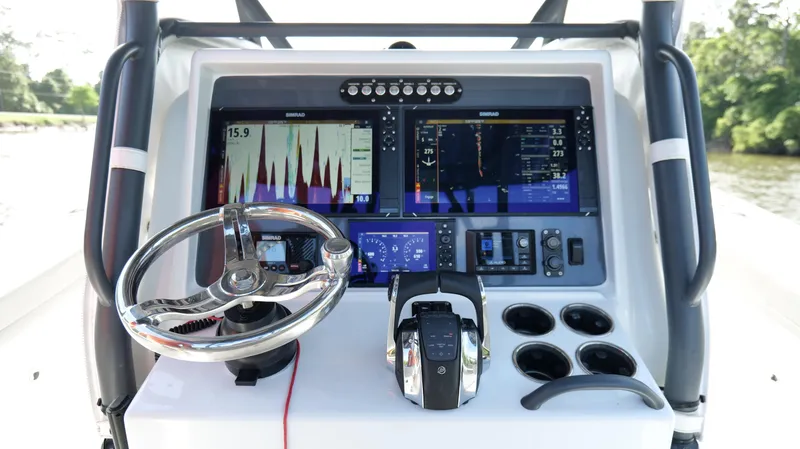 Slide: The Image of 2022 Yellowfin 34 boat dashboard with advanced navigation and control systems. - 14