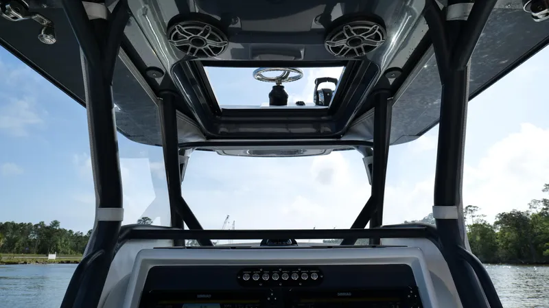 Slide: The Image of 2022 Yellowfin 34 boat interior with modern dashboard and overhead speakers. - 20