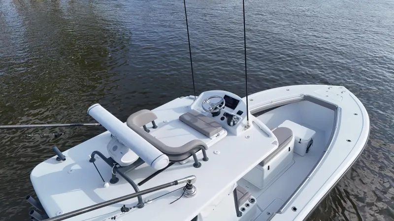 Slide: The Image of 2022 Yellowfin 34 boat on calm water, featuring a sleek design and modern console. - 22