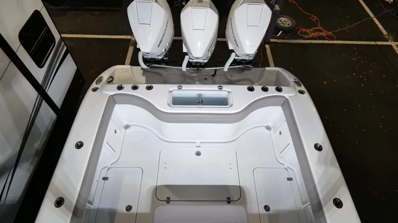 Slide: The Image of 2022 Yellowfin 34 boat with triple outboard engines, spacious deck layout. - 27