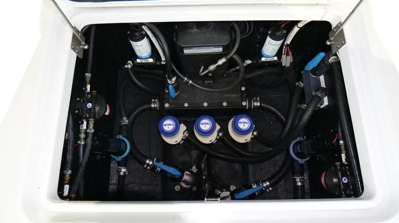 Slide: The Image of 2022 Yellowfin 34 boat engine compartment with visible wiring and components. - 31