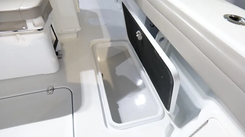 Slide: The Image of 2022 Yellowfin 34 boat interior with open storage compartment and seating area. - 32