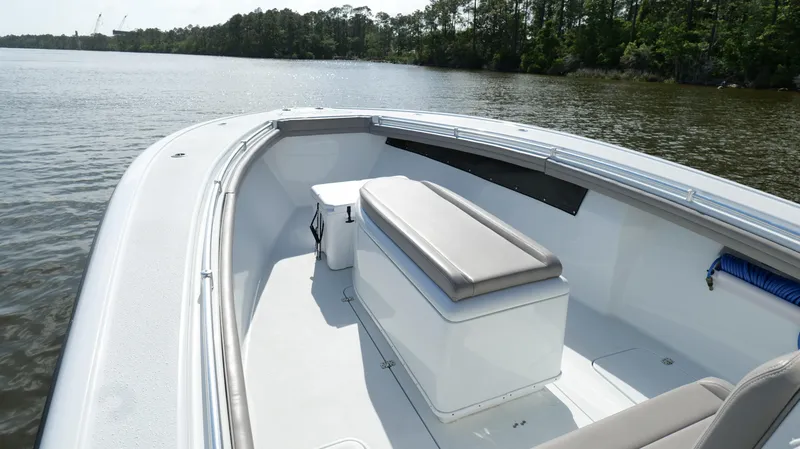 Slide: The Image of 2022 Yellowfin 34 boat on calm water, featuring spacious seating and sleek design. - 39