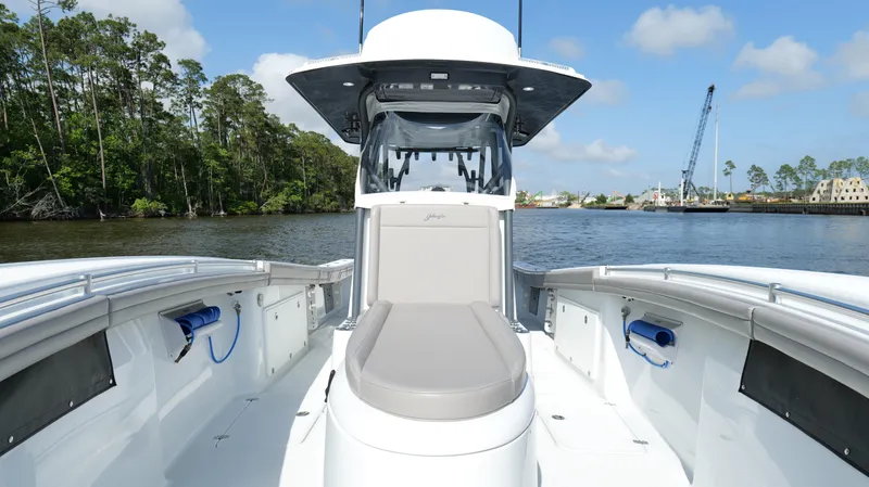 Slide: The Image of 2022 Yellowfin 34 boat on calm water, featuring spacious deck and modern design. - 42
