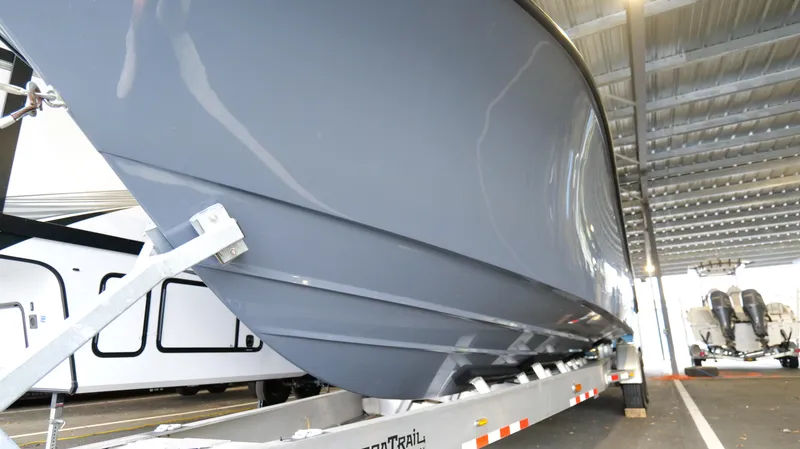 Slide: The Image of 2022 Yellowfin 34 boat on trailer under shelter, side view. - 55