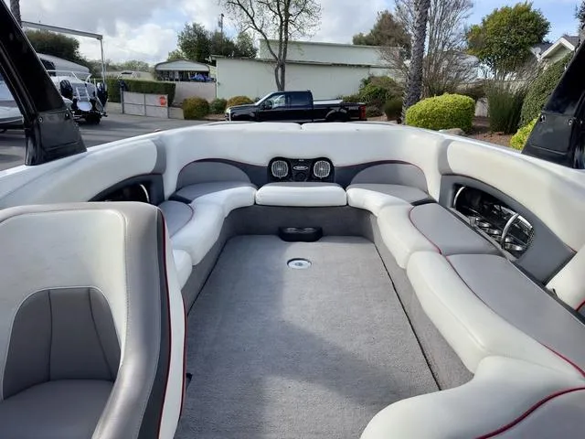 Slide: The Image of 2006 Malibu 247 LSV boat interior with spacious seating and modern design. - 18