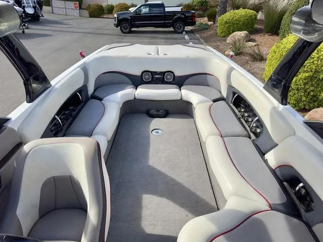 Slide: The Image of 2006 Malibu 247 LSV boat interior with spacious seating and modern design. - 19