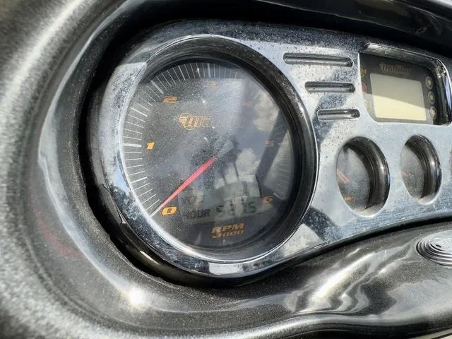 Slide: The Image of Close-up of 2006 Malibu 247 LSV boat dashboard with RPM gauge and digital display. - 22