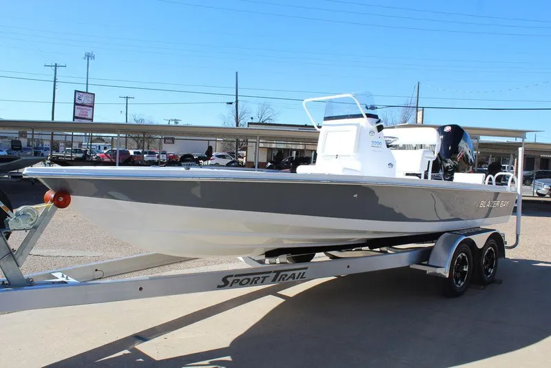 Slide: The Image of 2025 Blazer 2220 Fisherman boat on Sport Trail trailer, parked outdoors. - 10