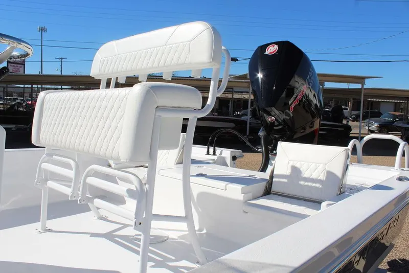 Slide: The Image of 2025 Blazer 2220 Fisherman boat with white seating and powerful outboard motor. - 11