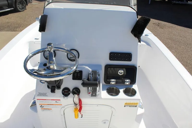 Slide: The Image of 2025 Blazer 2220 Fisherman boat console with steering wheel and controls. - 15