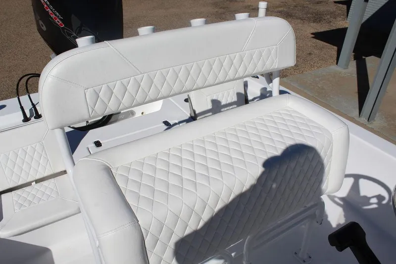 Slide: The Image of 2025 Blazer 2220 Fisherman boat with white quilted seating and steering wheel. - 17