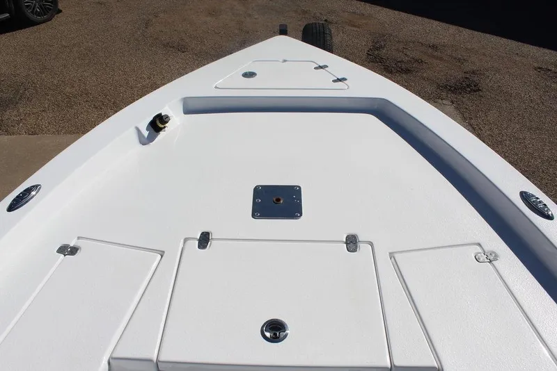 Slide: The Image of 2025 Blazer 2220 Fisherman boat deck with storage compartments and clean white finish. - 20