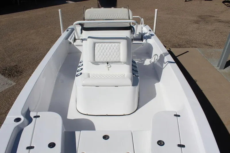 Slide: The Image of 2025 Blazer 2220 Fisherman boat interior with white seating and console, ideal for fishing. - 21