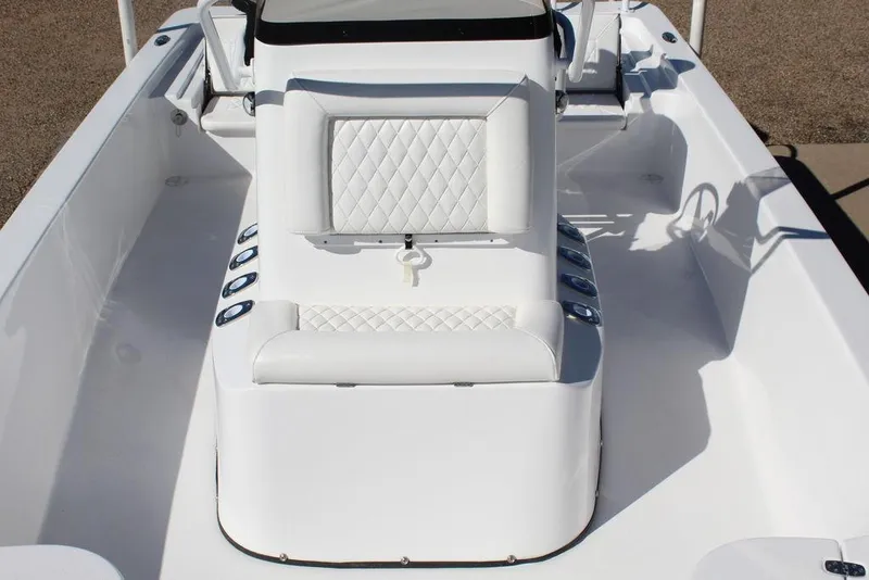 Slide: The Image of 2025 Blazer 2220 Fisherman boat interior with white seating and console. - 22