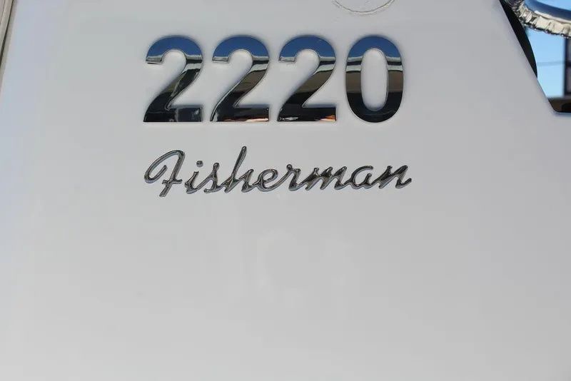 Slide: The Image of Blazer 2220 Fisherman 2025 model nameplate on boat exterior. - 23