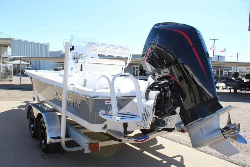 Slide: The Image of 2025 Blazer 2220 Fisherman boat on trailer with powerful outboard motor. - 7