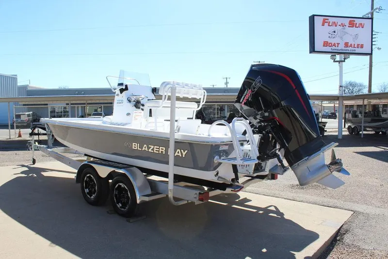 Slide: The Image of 2025 Blazer 2220 Fisherman boat on trailer at dealership, rear view. - 8
