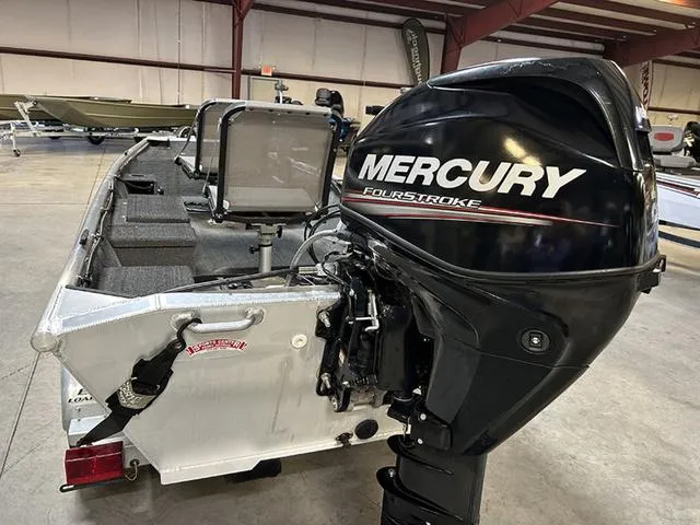 Slide: The Image of 2021 XTREME BOATS River Skiff 15452 SS with Mercury FourStroke engine in a showroom. - 10